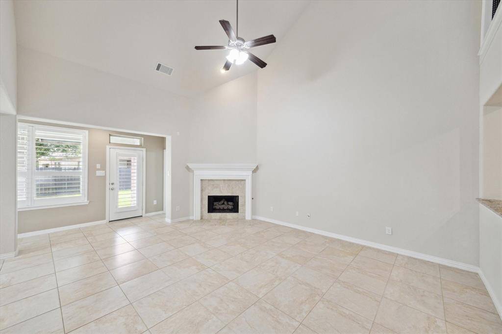Enormous Family room (19x15) with gas log fireplace, soaring ceilings, open to kitchen and breakfast rooms. Nice windows and abundant natural light overlook backyard and patio.