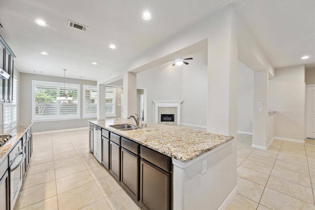 Another view of this functional and efficient kitchen. Washer, dryer and refrigerator to remain with the property.Recessed lighting and under counter lighting.