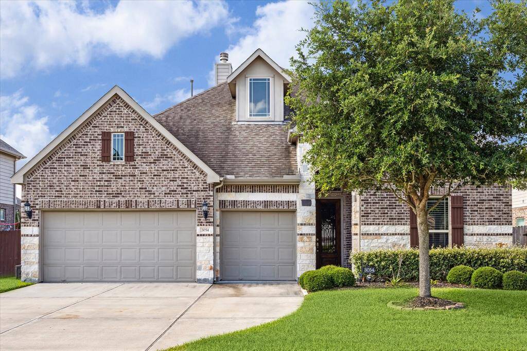 Elegant façade with stunning brick and stone accents.