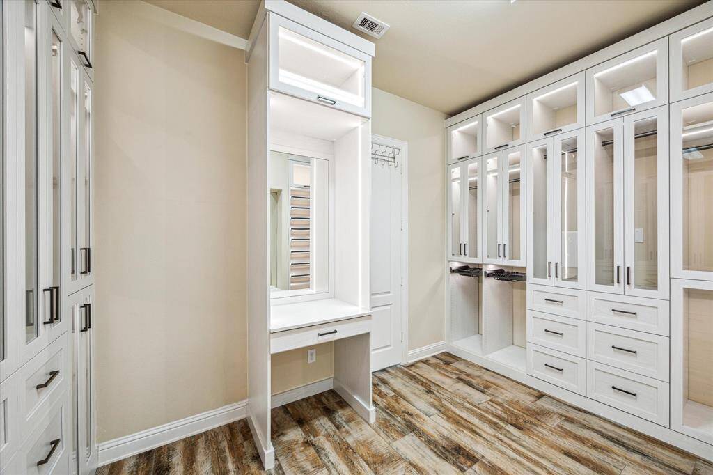 Sophisticated glass-door storage, ideal for all your clothing organization.