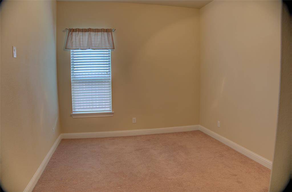 Spacious secondary bedroom accommodating a king-size bed.