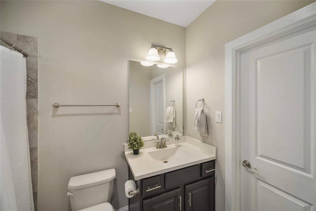 First-floor guest bedroom with a spacious walk-in closet.