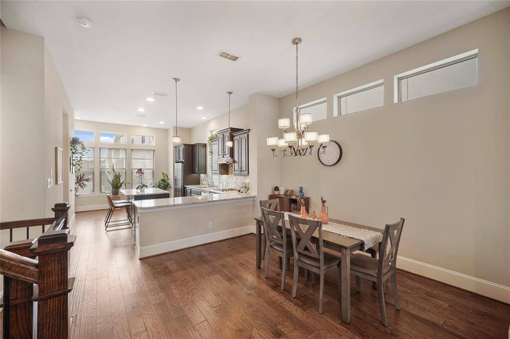 Elegant second-level dining room with stylish upgraded fixtures.