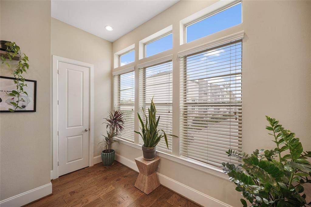 Bright and airy front windows with convenient pantry access on the left.