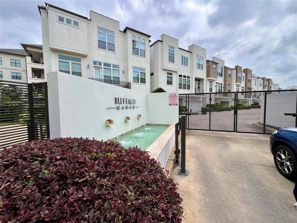 Discover your new home! Enjoy the charming fountain and secure gated entry.