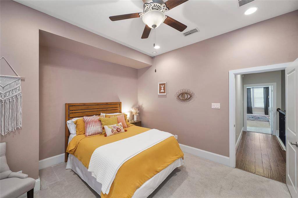 A cozy guest bedroom conveniently located just down the hall from the primary suite.