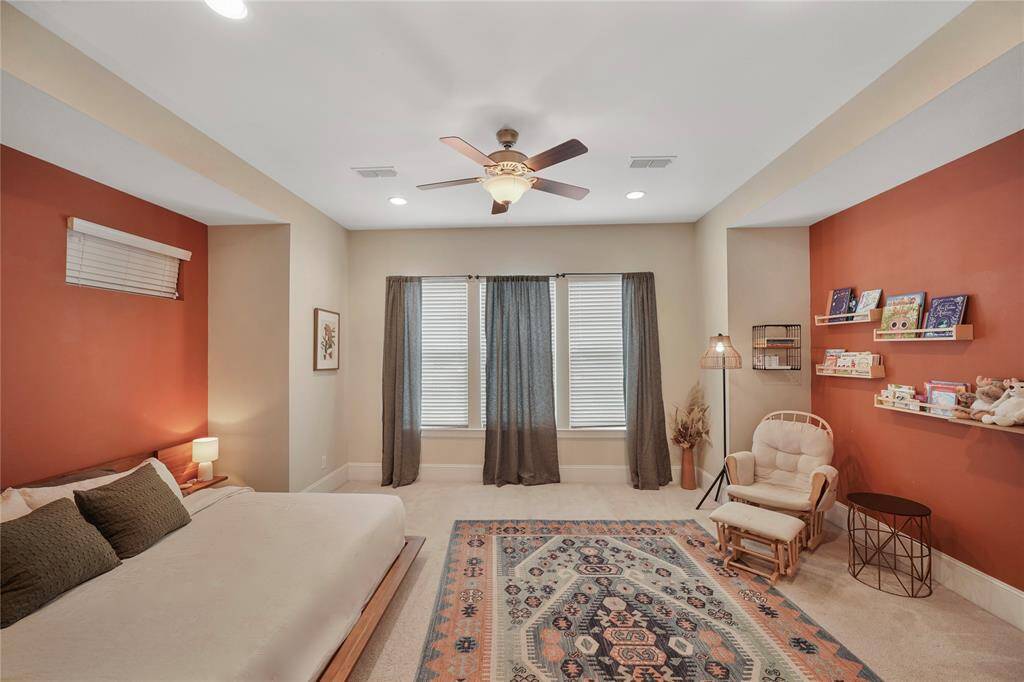 The primary bedroom offers a serene retreat at the rear of the home.
