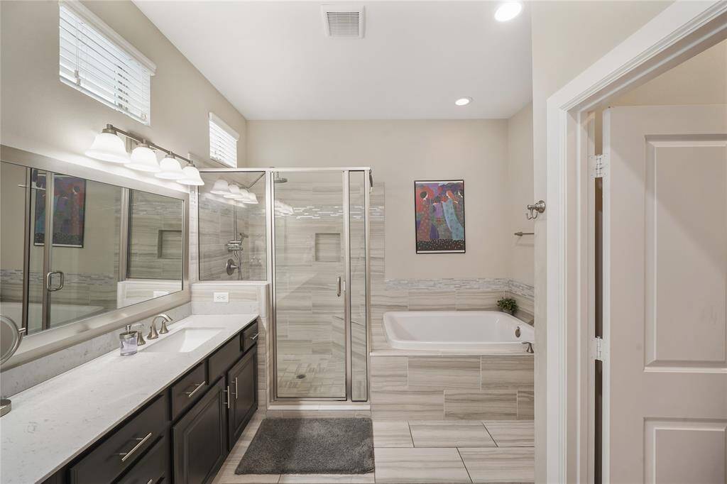 Unwind in the double-wide soaking tub, your personal oasis.