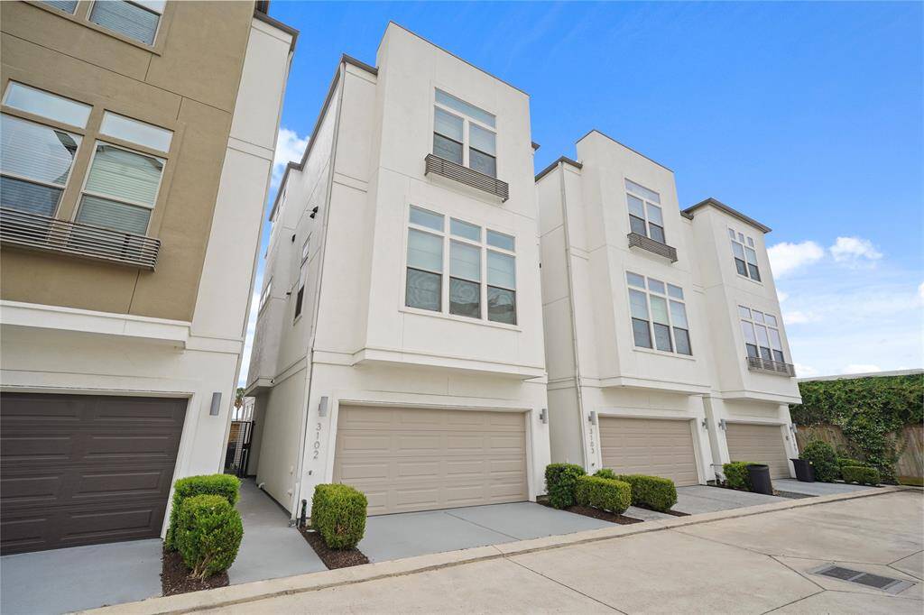 Alternate view towards entry with two-car garage.