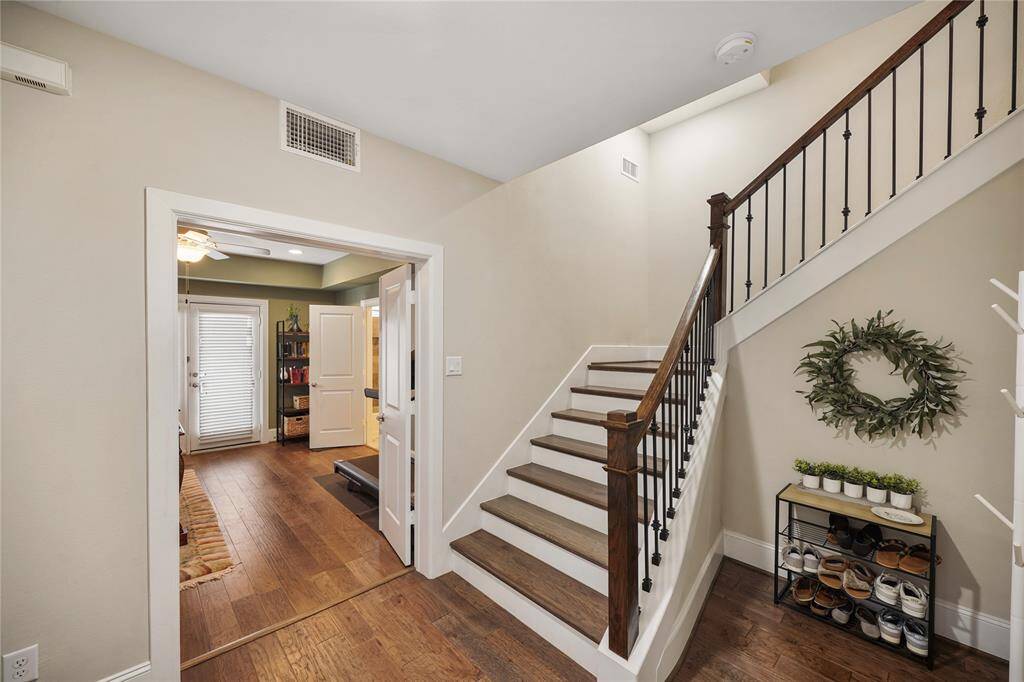 Elegant wood flooring greets you at the entrance.