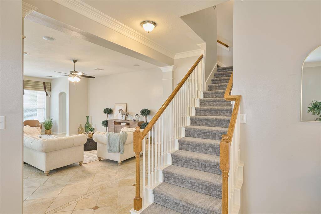 The staircase to the second floor is centrally located within the home.