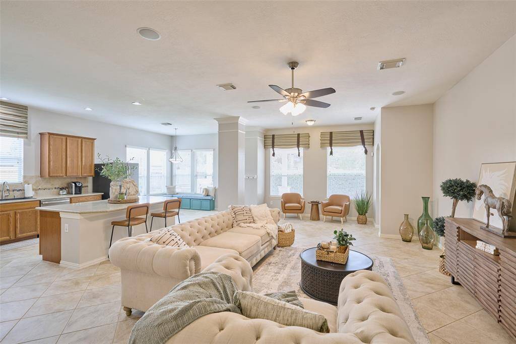 Extended beyond the family room, there is space available to create a convenient and cozy reading area near the windows.