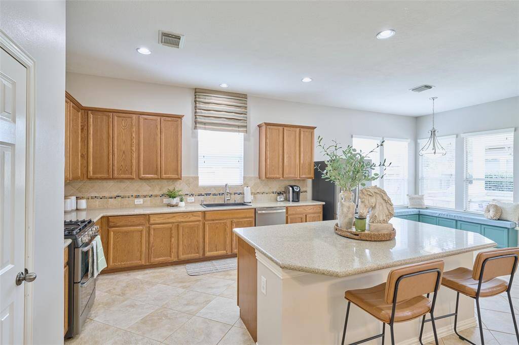 Another angle of the beautifully designed kitchen, sneak preview of the breakfast nook.