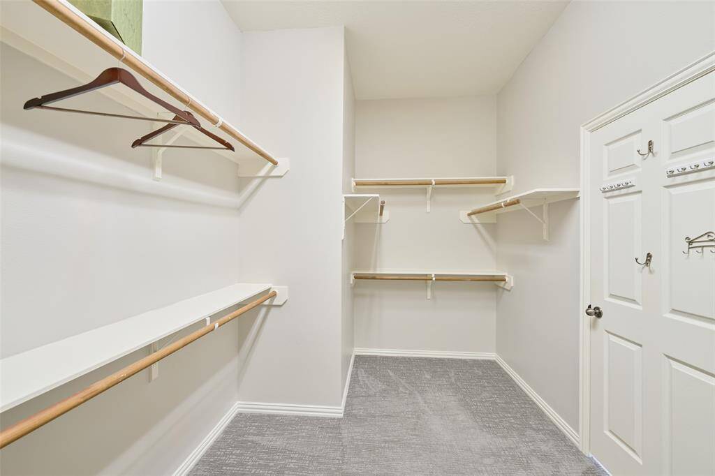 The primary walk-in closet does not disappoint!