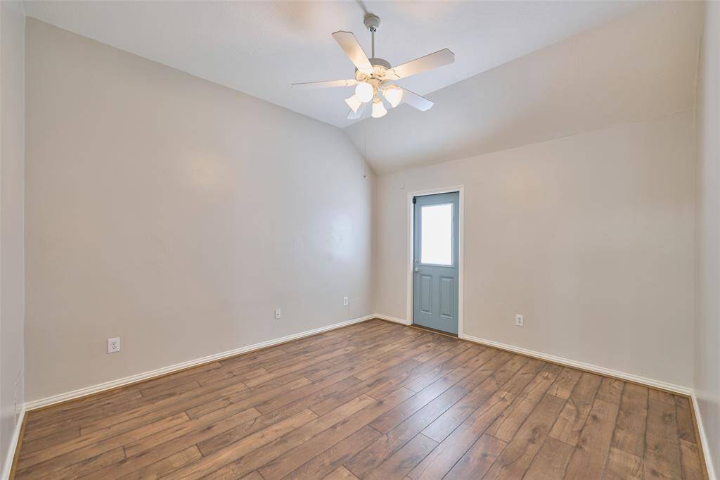 Extra flex room conveniently located near the secondary bedrooms, ideal for a children's game room or library, with a secondary access point leading to the pool.