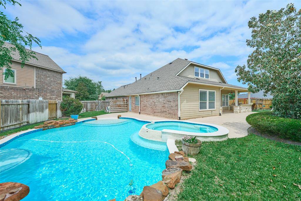 The entire backyard serves as a retreat, ideal for year-round entertaining.