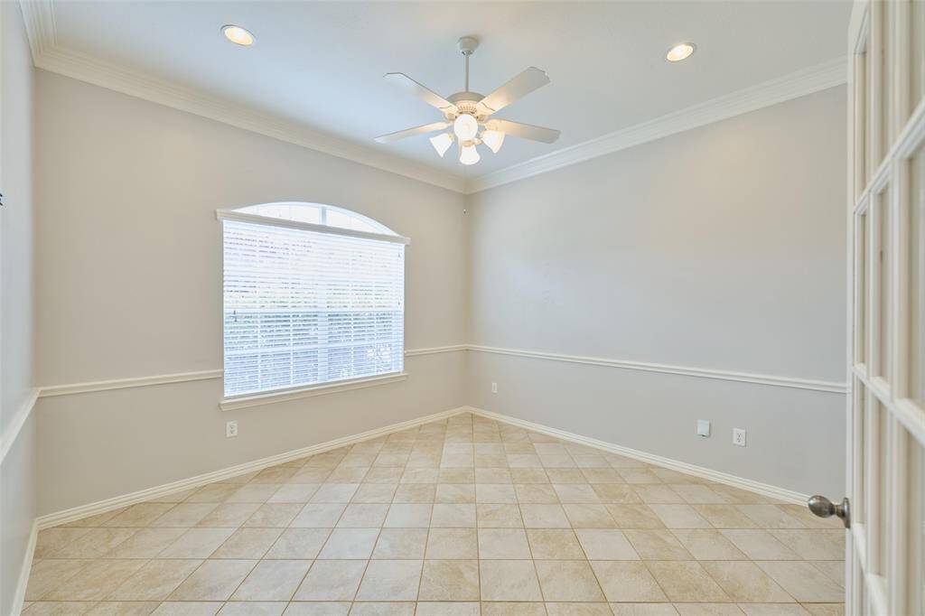 Work from home in this spacious designated office, featuring ample natural light and privacy.