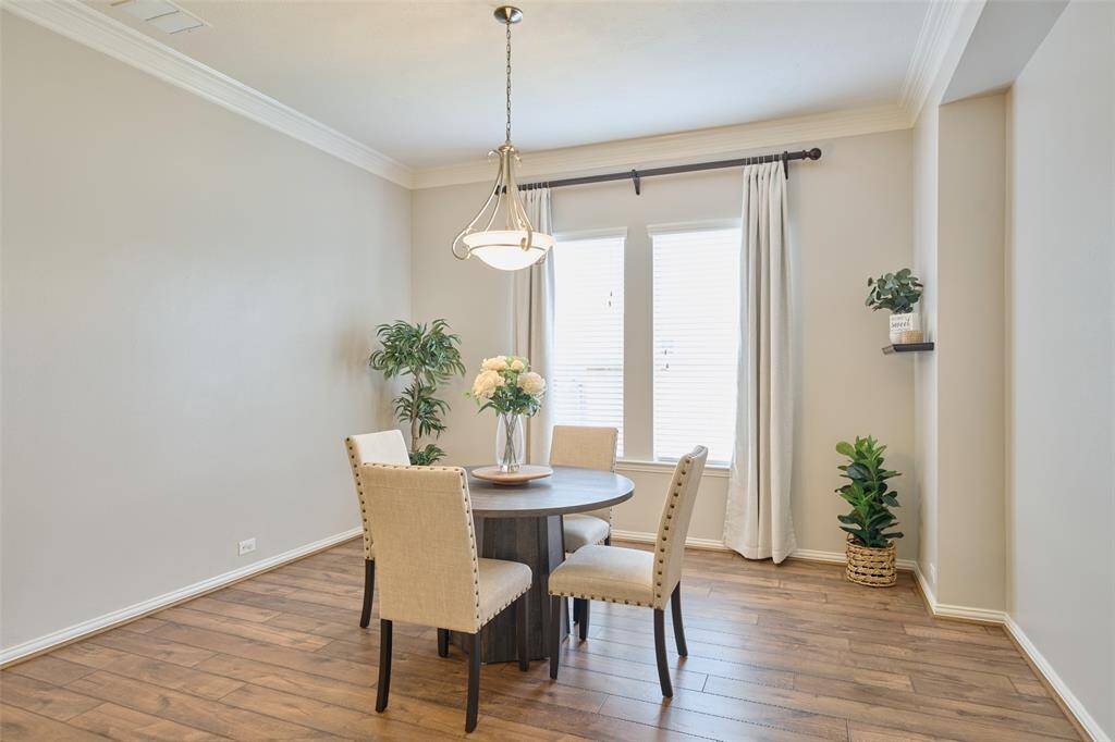The formal dining room is spacious and includes a recessed wall, ideal for showcasing your decor or furniture.