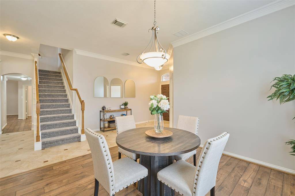 This offers an additional perspective of the entryway from the formal dining room.