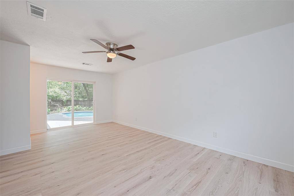 Primary Bedroom with doors to pool