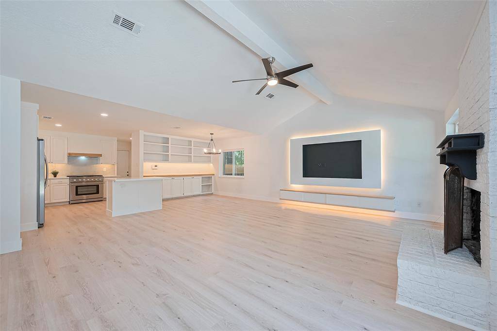 Large open area of kitchen  dining room and living room