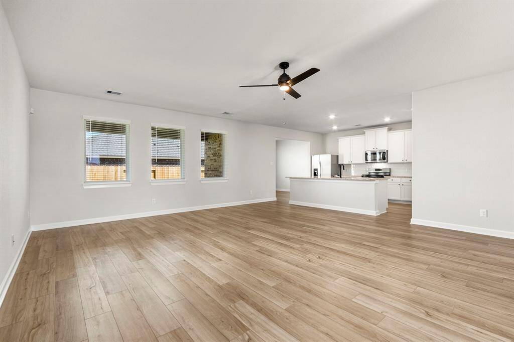Welcome home! This open floor plan design is perfect for entertaining! The spacious living room is flooded with natural light.