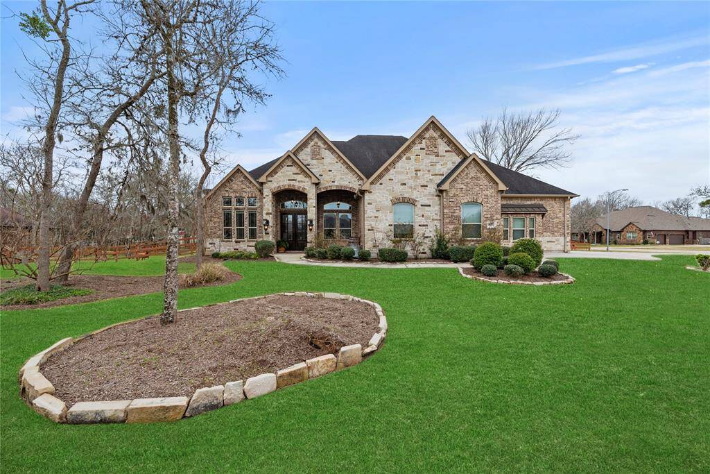 Welcome home to 32711 Wales Circle, nestled on a quiet cul-de-sac in the prestigious Weston Lakes community in Fulshear!