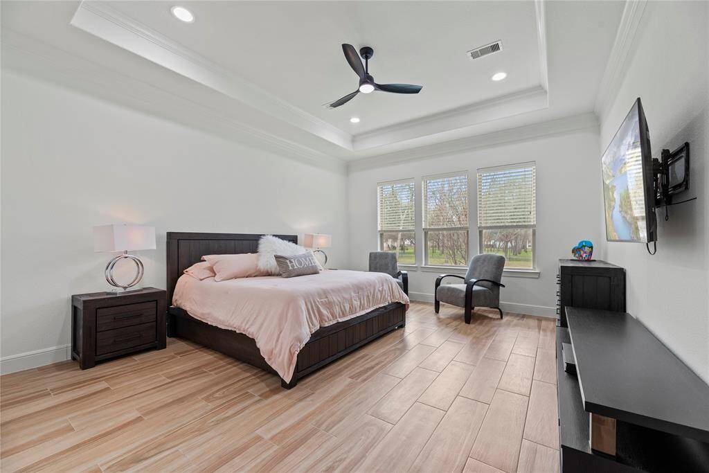 How perfect is this primary suite? Spacious and filled with natural light, this serene retreat offers the ultimate escape, promising comfort, tranquility, and pure relaxation.