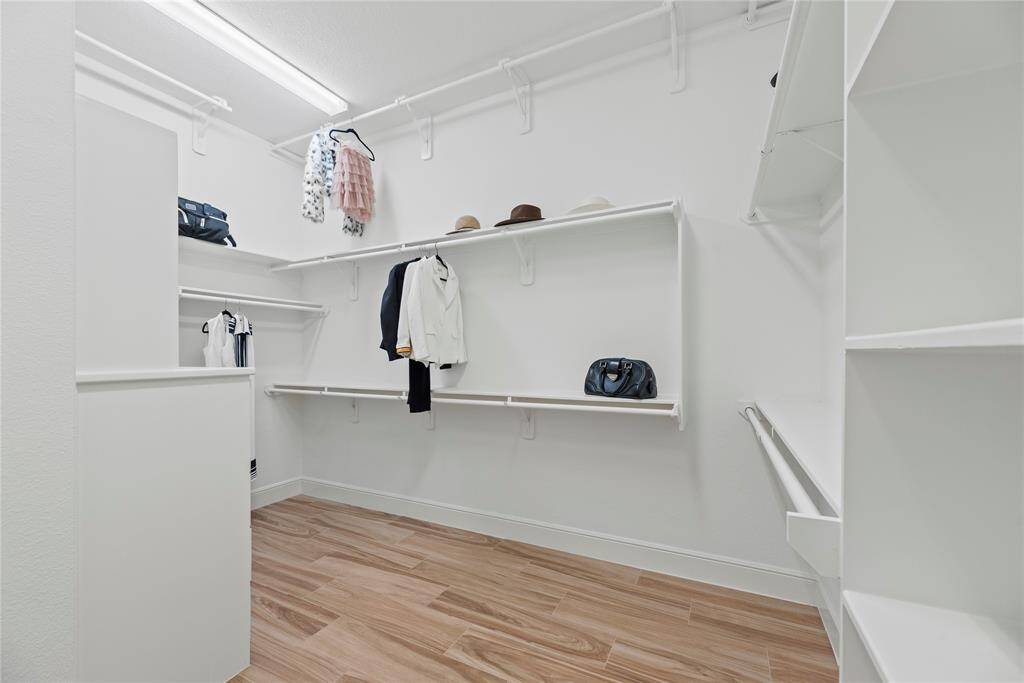 The primary closet provides generous space to store your entire wardrobe while keeping everything neatly organized and easily accessible.
