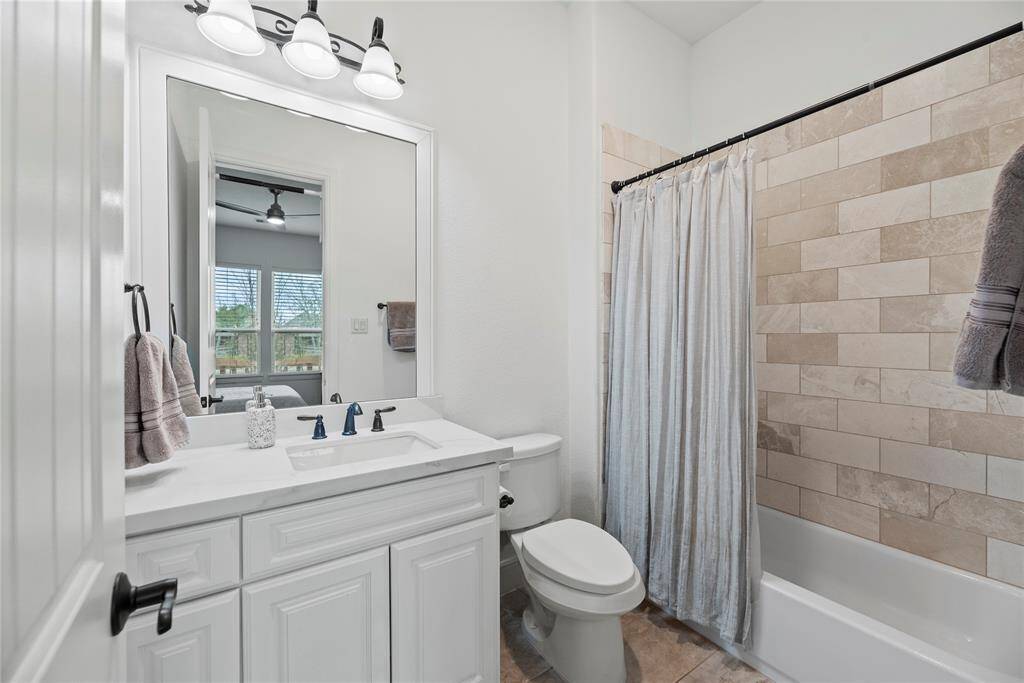 The private en-suite bath with large vanity ensures privacy.