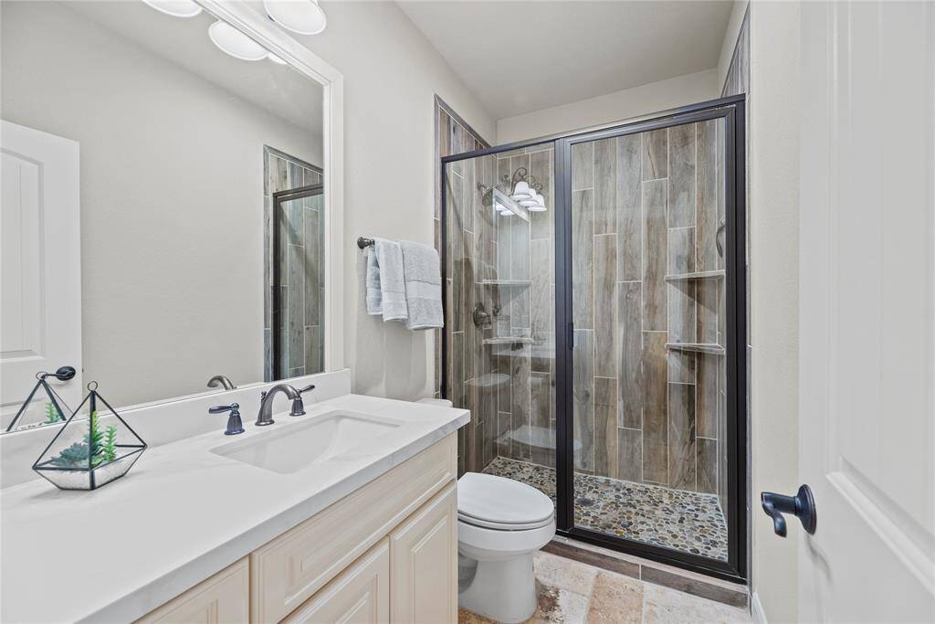 The upstairs full bath with a private vanity, offering convenience and comfort for any aged kids!