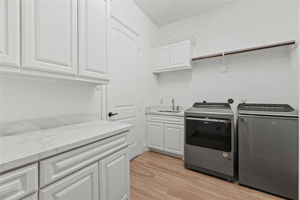 This well-appointed space includes ample storage and efficient organization, making laundry day a breeze while keeping your home tidy and functional.