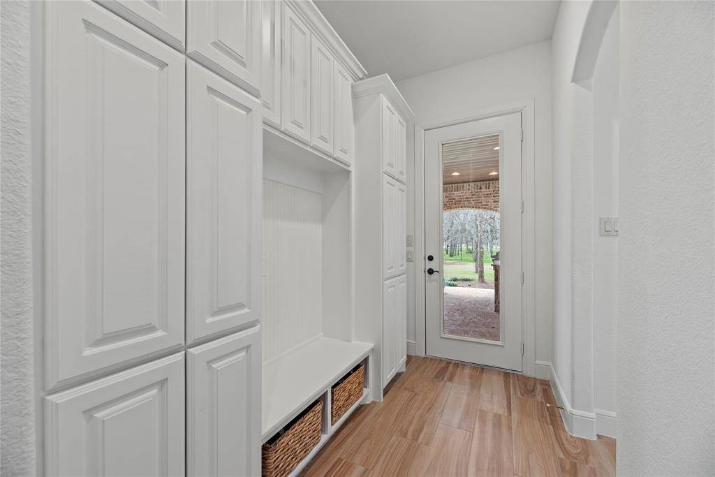 Steps from garage, this space simplifies the coming and going of the family and keeping everything organized.