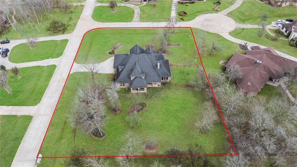 From this aerial view of the back of the home, you can fully appreciate its beauty, elegance, and remarkable charm.