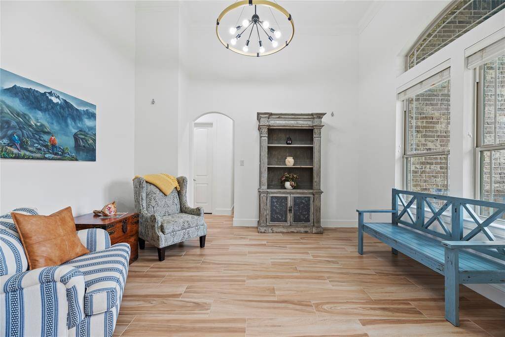 To the right of the entry, you'll find a stylish formal living area, perfect for entertaining guests or creating a cozy gathering space.