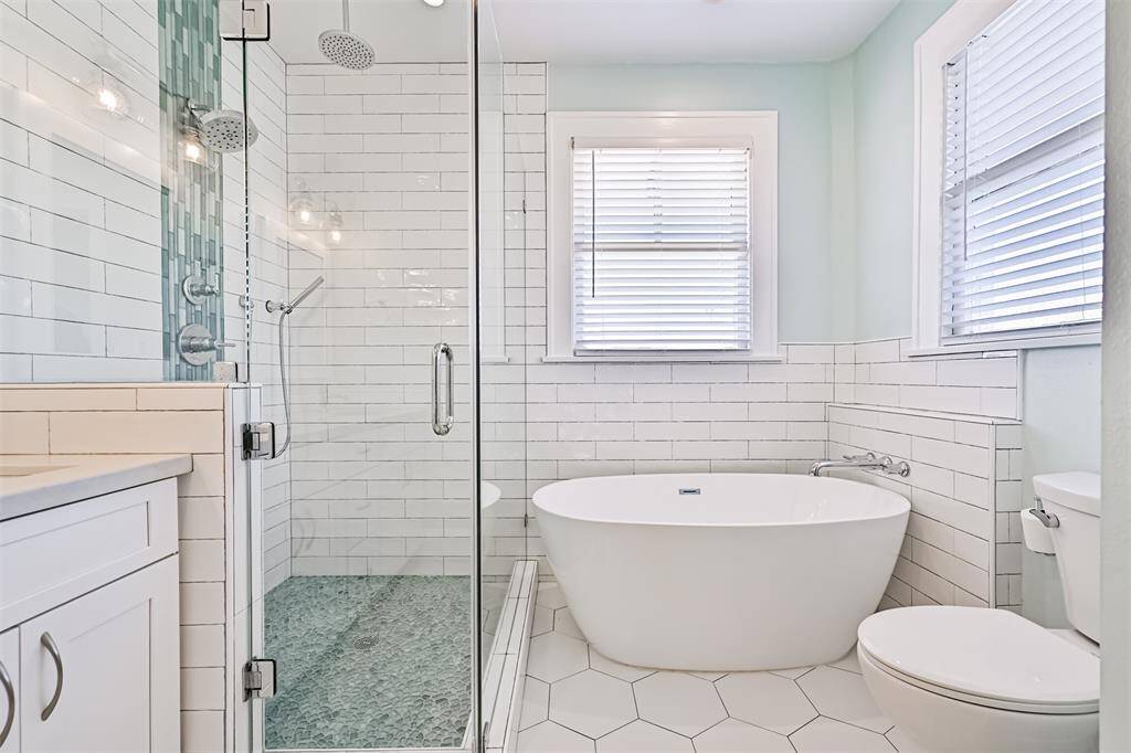 Spa like primary bath with freestanding soaker tub,