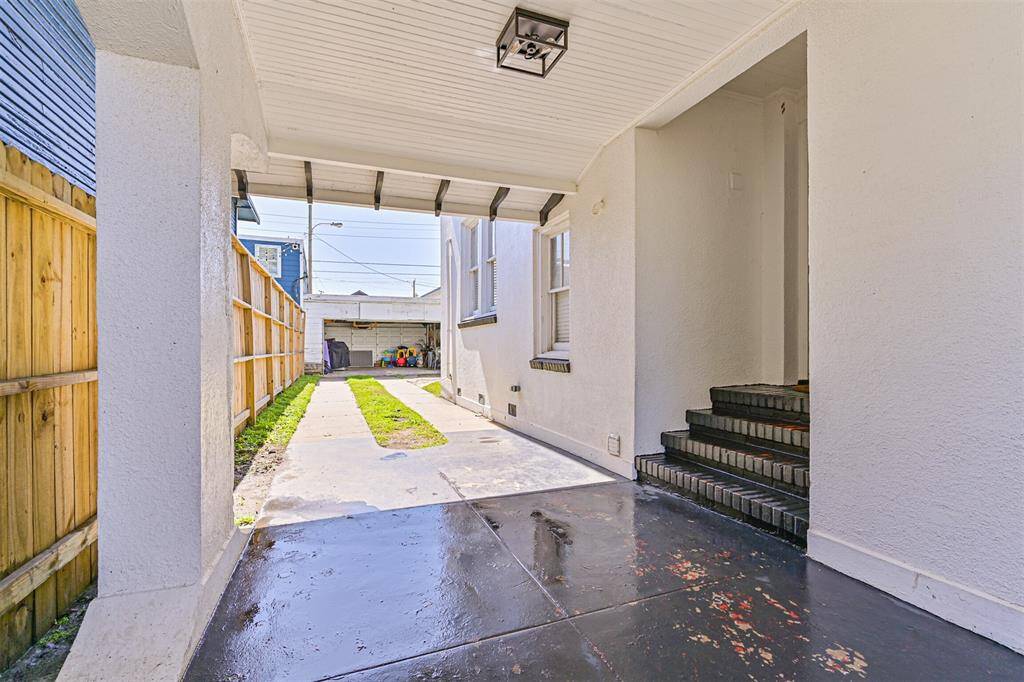 Beautiful, covered carport leading into the home