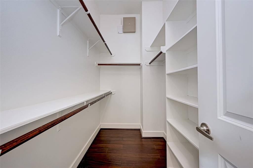 The primary closet is generously sized, featuring built-in shelving for optimal organization. With plenty of hanging space and additional storage, it’s designed to keep your wardrobe neatly arranged and easily accessible.