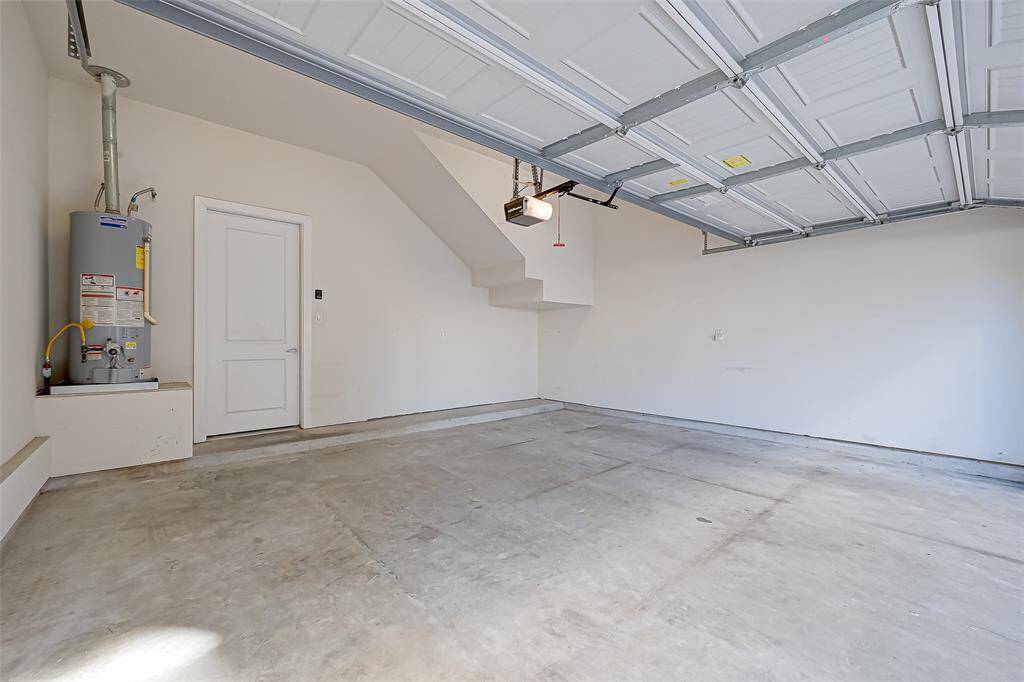 The spacious two-car garage offers plenty of room for both vehicles and additional storage. With a clean, organized layout, it provides ample space for tools, equipment, and everyday essentials.