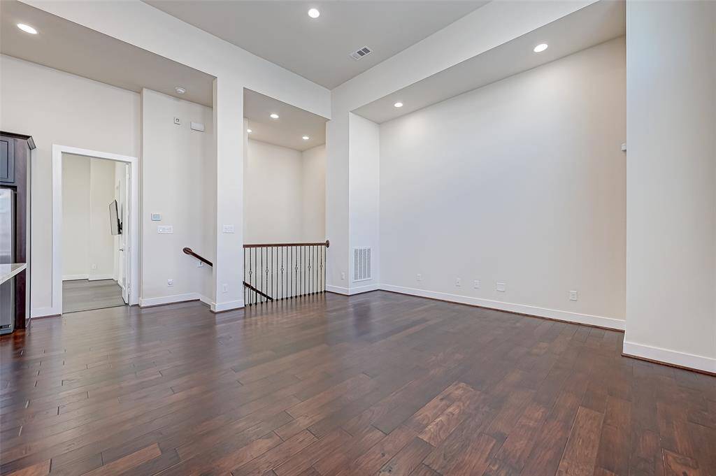 The second floor boasts an open-concept living area filled with natural light and modern finishes. The spacious layout seamlessly connects the living, dining, and kitchen areas, perfect for entertaining or everyday living.