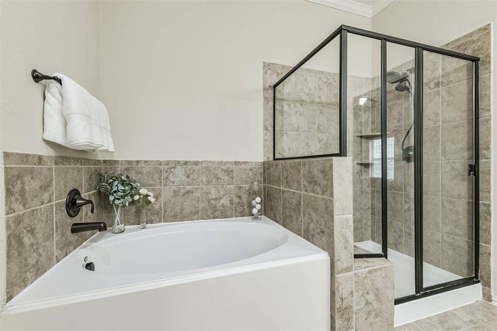 A deep tub and separate shower