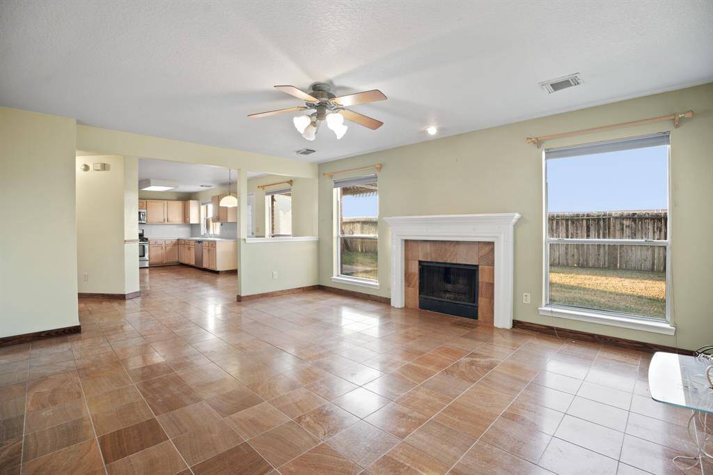 Another view of the spacious family room shows how well it opens up to the breakfast nook and kitchen.  So inclusive.  The open layout is a must for every family.
