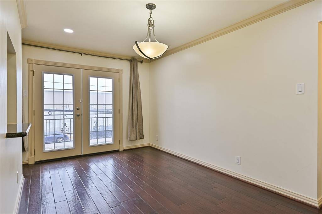 The dining area opens to a private outdoor patio, blending indoor and outdoor living.