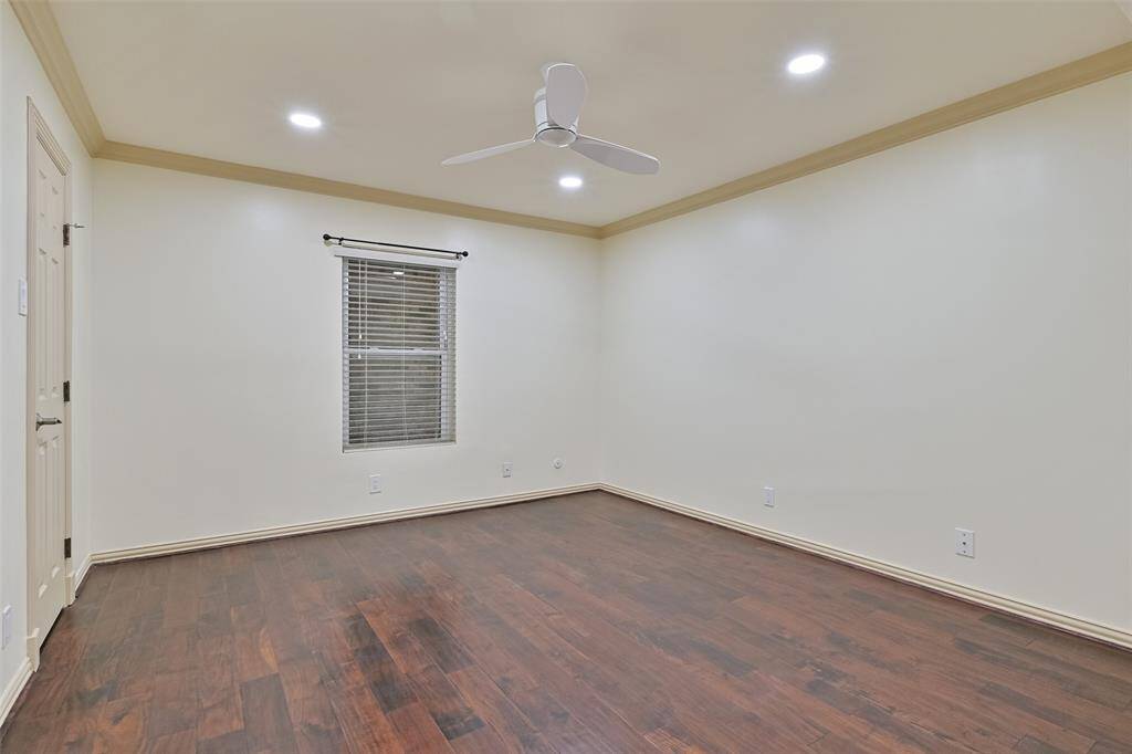 The westside second bedroom is a private retreat, complete with rich wood floors, a spacious walk-in closet, and an ensuite bathroom.