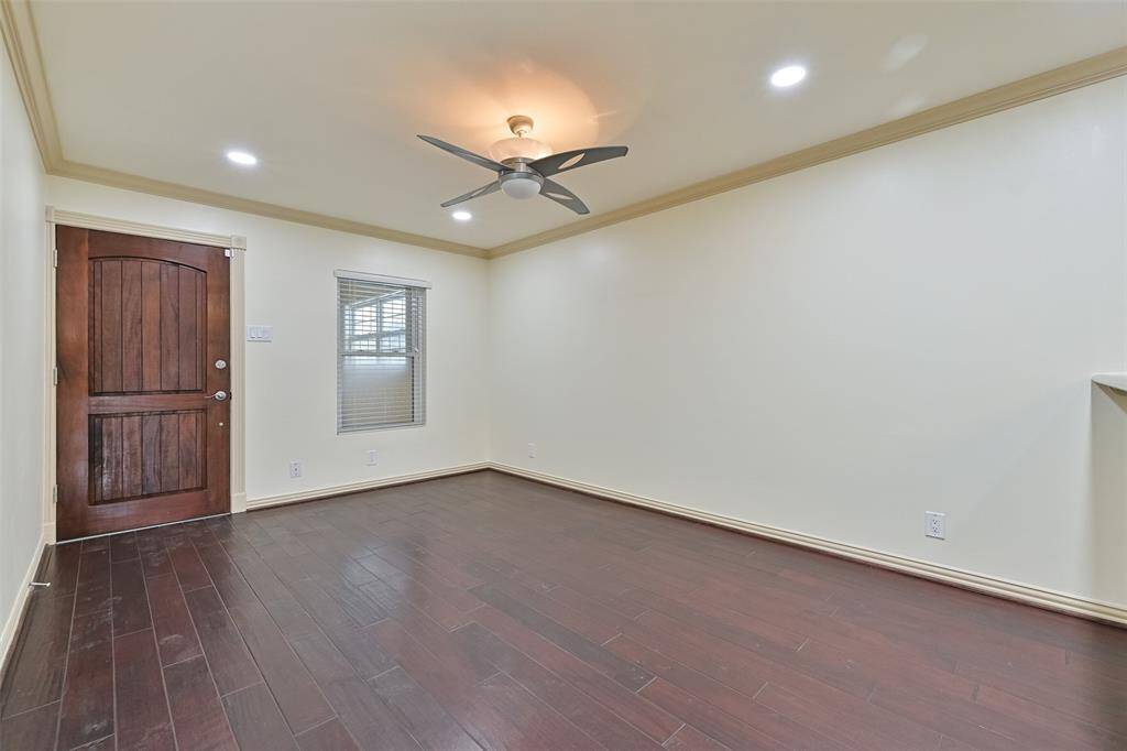 Elegant hardwood floors extend throughout, enhancing the home’s stylish and cohesive design.
