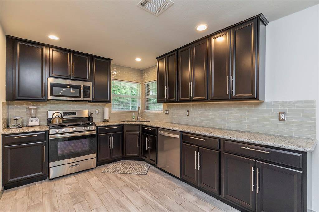 Dining room space sits between living room and kitchen.