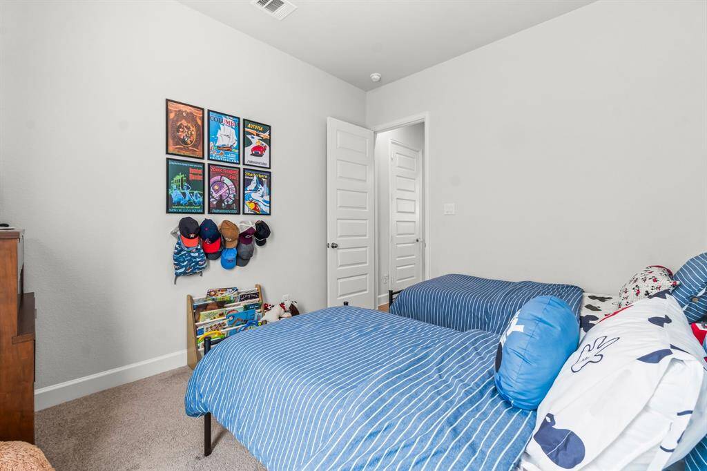 Secondary bedroom on first floor just off the kitchen.