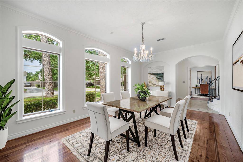 Spacious Dining Room with pine floors. Virtually Staged.