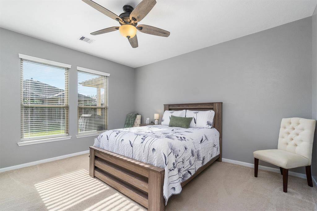 Primary bedroom is light and bright