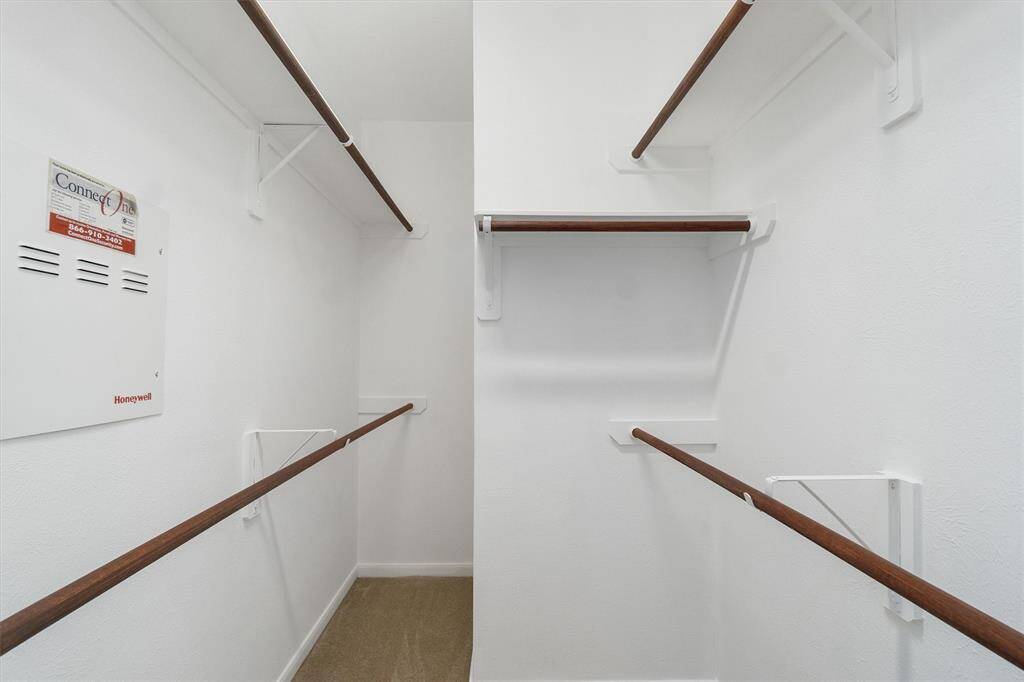 Large walk in closet with fresh paint